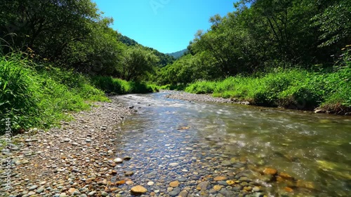 Mountain creek natural scenery, clear stream pebble channel