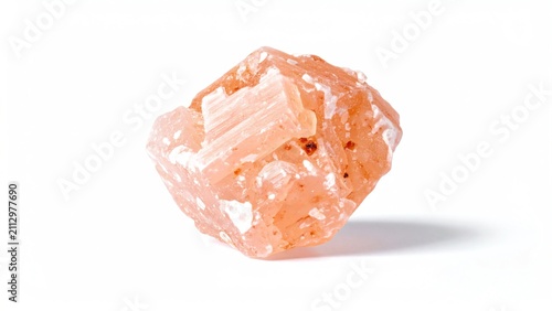 Single pink stilbite crystal mineral isolated on white background