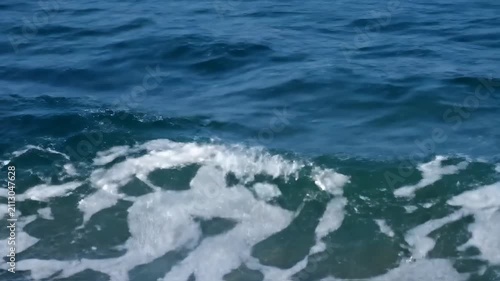Close up of blue sea waves, animated surface of azure waves
