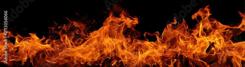 Blazing inferno of orange, red, and yellow flames against a stark black background