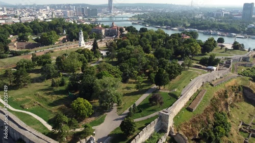 Wide forward drone shot over Kalemegdan fortress with Belgrade city panorama in the background, Serbia.