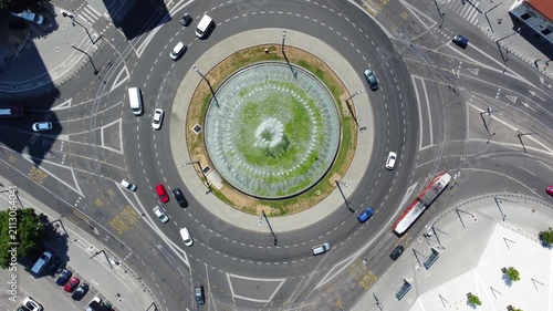 Iconic Slavija Square, a busy traffic circle with large central fountain in Belgrade, Serbia. Top down aerial view.