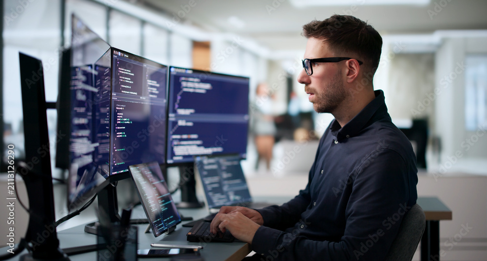 Obraz premium Young Software Engineer Coding Algorithm On Laptop