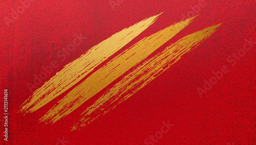 Abstract textured background with golden brush strokes on red surface