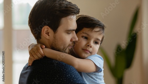 Pediatric psychology portrait demonstrates filial bonding. Close emotional connection exemplifies healthy childhood development, nurturing paternal behavior, and attachment theory