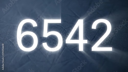 A series of glowing white numbers displayed on a dark textured surface