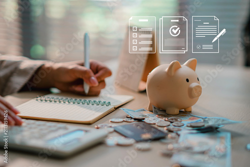Piggy bank surrounded by cash and coins with virtual financial plan check icons, concept of tax planning, budgeting, and wealth management