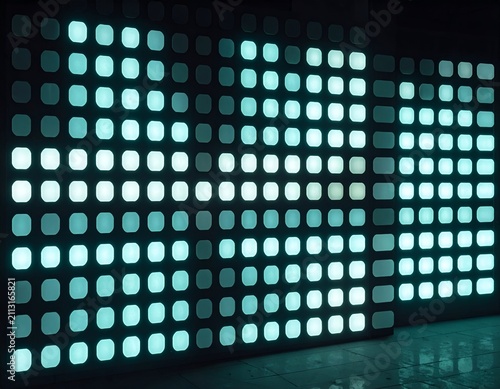 Wall display of glowing cyan-colored squares, forming abstract, luminous pattern in dark space