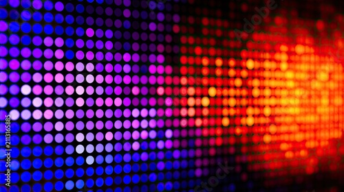 Vibrant illuminated dots transitioning from cool purple to warm red and orange