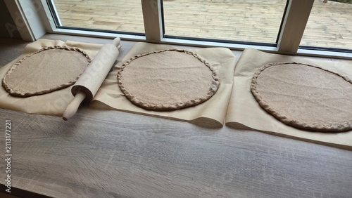Making dough circles for a baking session at home