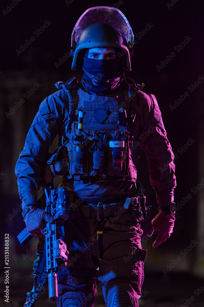 Obraz premium Tactical Soldier In Night Operations Wearing Ballistic Helmet Body Armor And Holding Rifle