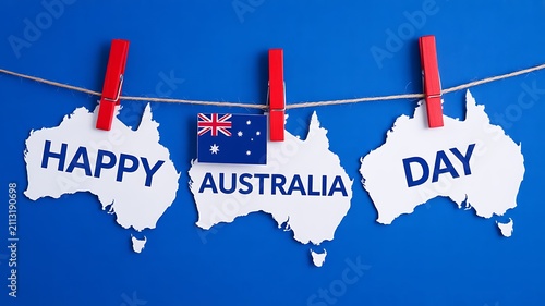 Happy Australia day banner with Australian flag and map shapes hanging on clothesline over blue background