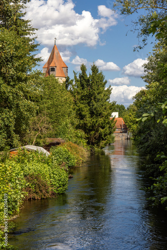 The Muehlengraben is a idyllic side arm of the river Eder below the old town of Fritzlar, Hesse, Germany, with view to the historic Pulpit Tower