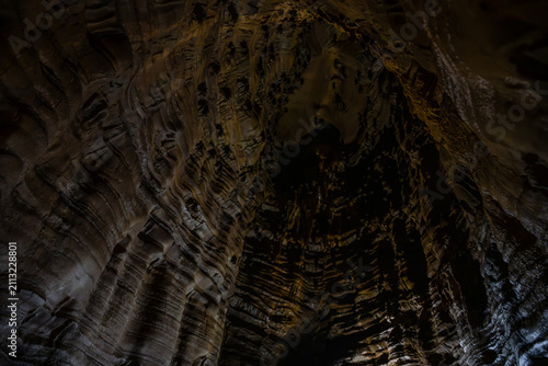 Bild auf Leinwand Rock formations inside a cave in Sukamakmur