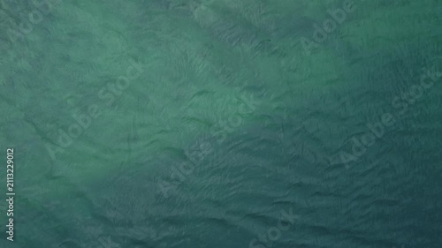 Waves moving in the ocean during the day near the shore