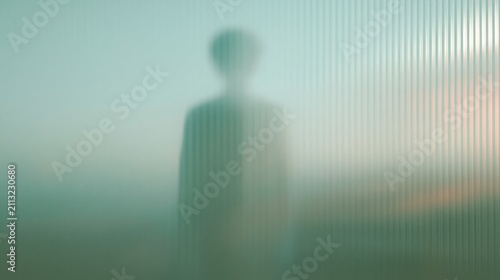 Person silhouette behind frosted ribbed glass
