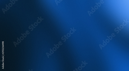 blue gradient abstract background filled with a very soft grain texture and bluish-white light that spreads gently across the field