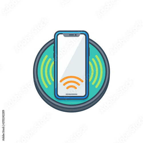 A modern smartphone charging on a wireless power pad device
