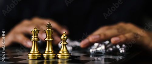 King chess on falling chess concept of business strategy plan and leadership or wining challenge and team player and risk management or human resource or strategic planning.