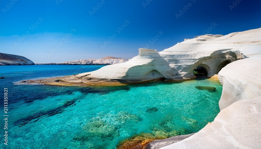 Obraz premium sarakiniko beach or moon beach with a natural arch of white volcanic rocks and transparent water in milos cyclades islands greece