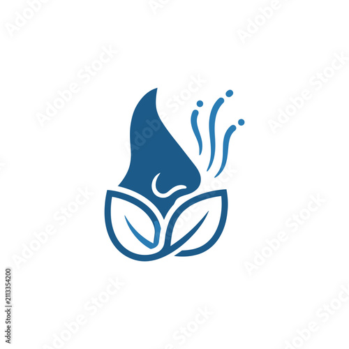 Human nose smelling aroma from organic blue leaves.