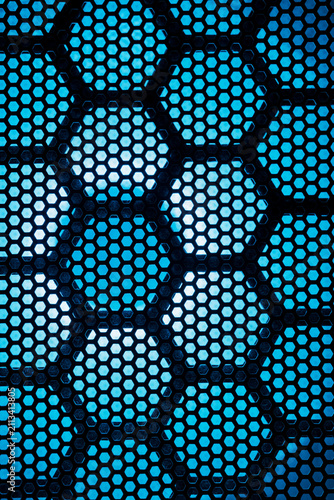 Close-up of hexagonal vent patterns on illuminated gaming rig