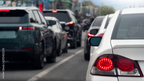Cuadro en lienzo Close up view of white car tun on brake light on asphalt road