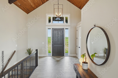 Spacious modern entryway with wooden beams
