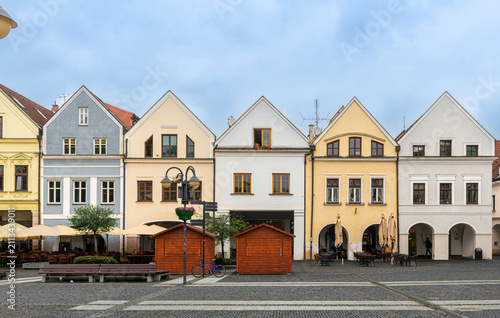 Traditional pastel-colored burgher houses lining Marianske Square in Zilina, Slovakia. Elegant facades, arcades, steep gabled roofs, and preserved medieval architecture showcase the charm of the city'