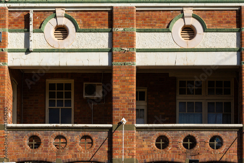Peeling paint on brick facade of the royal oak hotel