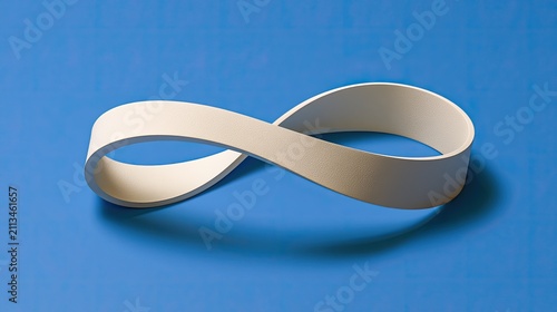 Endless white ribbon forms an infinity symbol against a bright blue background