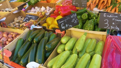 Vegetable market stall with French written prices