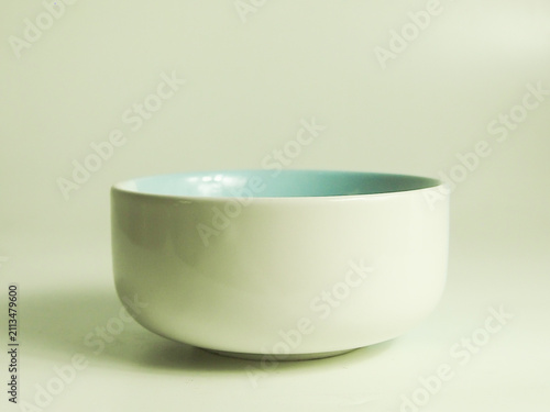 white ceramic bowl with light blue interior isolated on white background