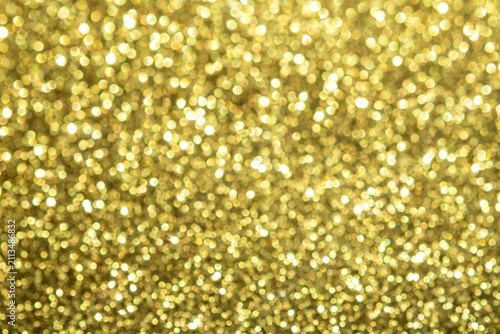 Golden glitter bokeh background with sparkling texture for festive and luxury design projects