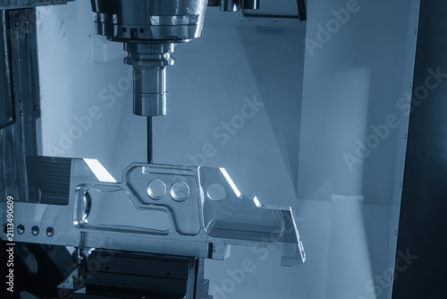 High-precision 5-axis CNC milling machine cutting an aerospace part with a flat nose end mill tool.