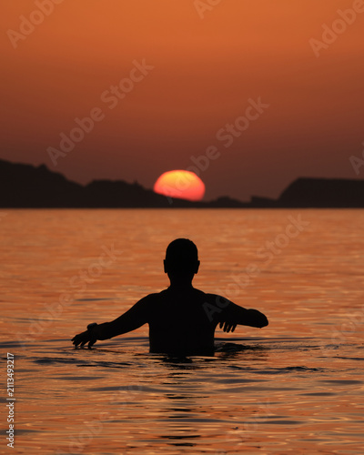watching the sun hide away