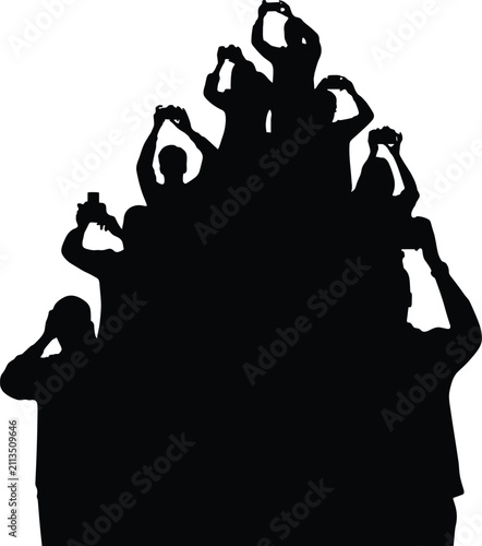Obraz na plátně Silhouette of a Crowd of People Holding Up Cameras to Take Photos group audience