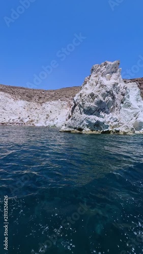 Sailing along white beach in akrotiri, santorini island