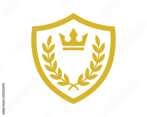 Golden shield logo design with royal crown, laurel wreath, and stars, luxury premium crest emblem vector illustration isolated on dark background