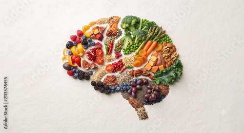 Creative healthy nutrition brain concept made from fruits vegetables grains nuts and seeds symbolizing balanced diet brain health and wellness