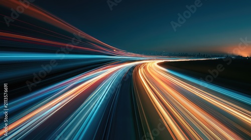 Streaking lights on a highway at dusk create a sense of speed and motion