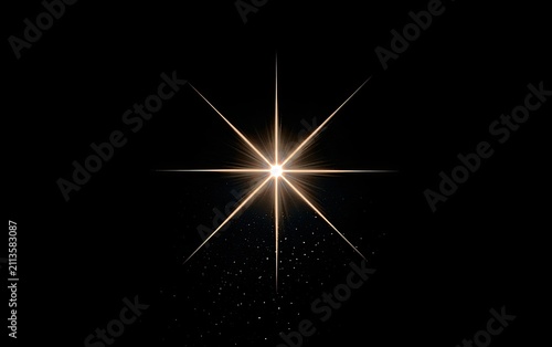 Radiant bright starburst emanating light on a dark background with small particles