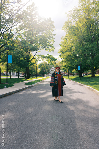 smiling latina doctorate on graduation day in all her regalia