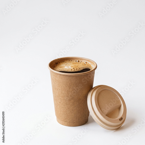 Takeaway coffee cup with lid filled with hot beverage isolated on white background.