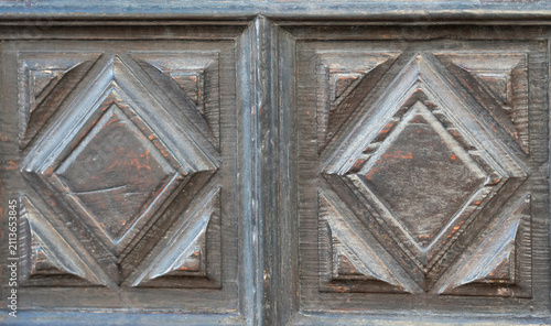 Antique carved wooden door panels with geometric diamond pattern