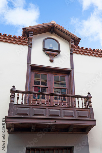Traditional wooden Canarian balcony with religious niche, La Laguna, Tenerife