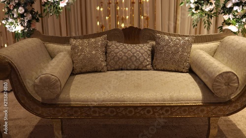 Decorated chairs with cushions on a wedding