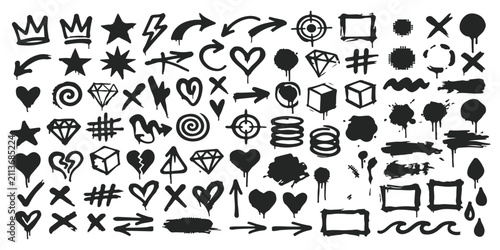 Set of hand drawn graffiti spray paint elements including hearts stars arrows and geometric shapes
