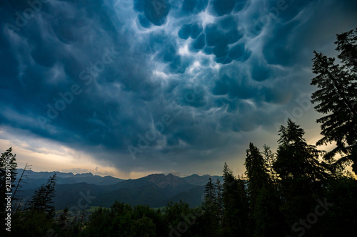 Dramatic Mammatus Clouds Above Mountain Forest Before Storm