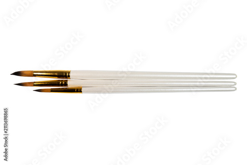 Quadro su tela Three precision paintbrushes with white handles golden ferrules tapered bristles